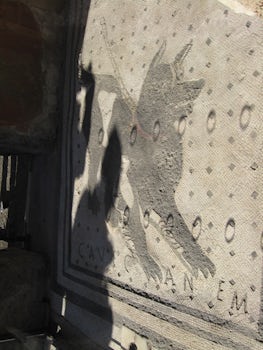 Famous tile work on door step at Pompeii saying "Beware of Dog".