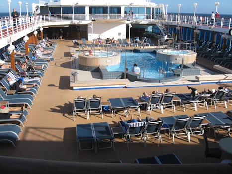 Pool deck on the Pacific Princess, no chair hoggers and great hot tubs.