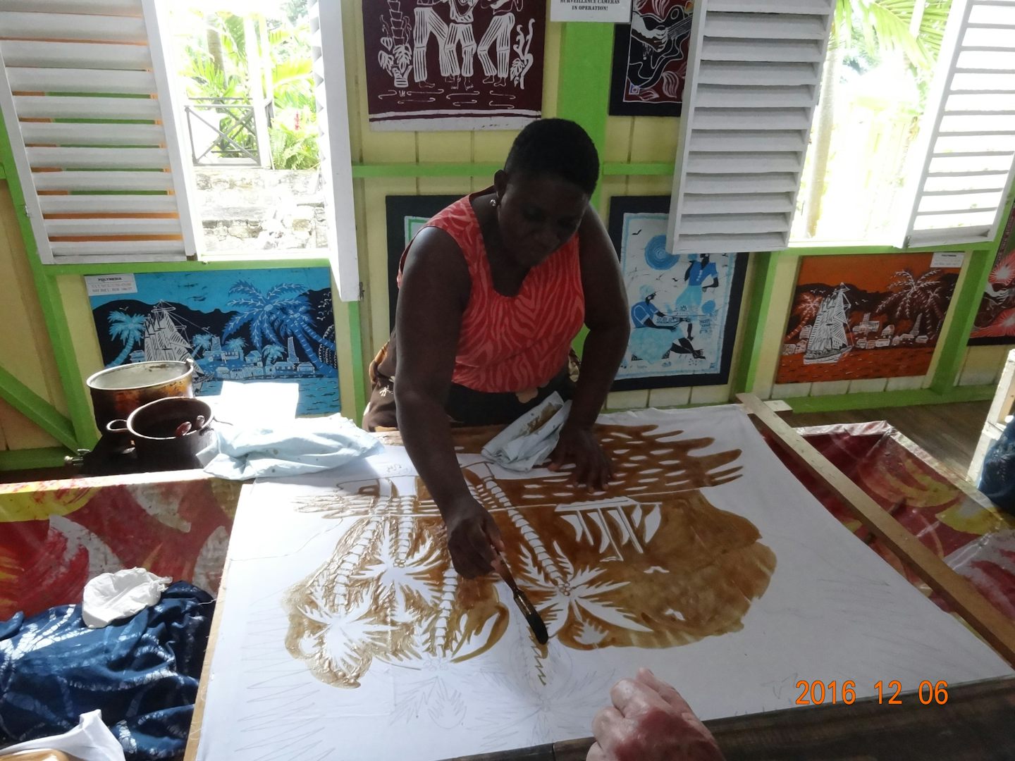At Romney Manor the women are doing an art form called Batik, which involves waxing  the material and coloring what you want to highlight and then boiling the wax off after the colors have been added.  Very time consuming.