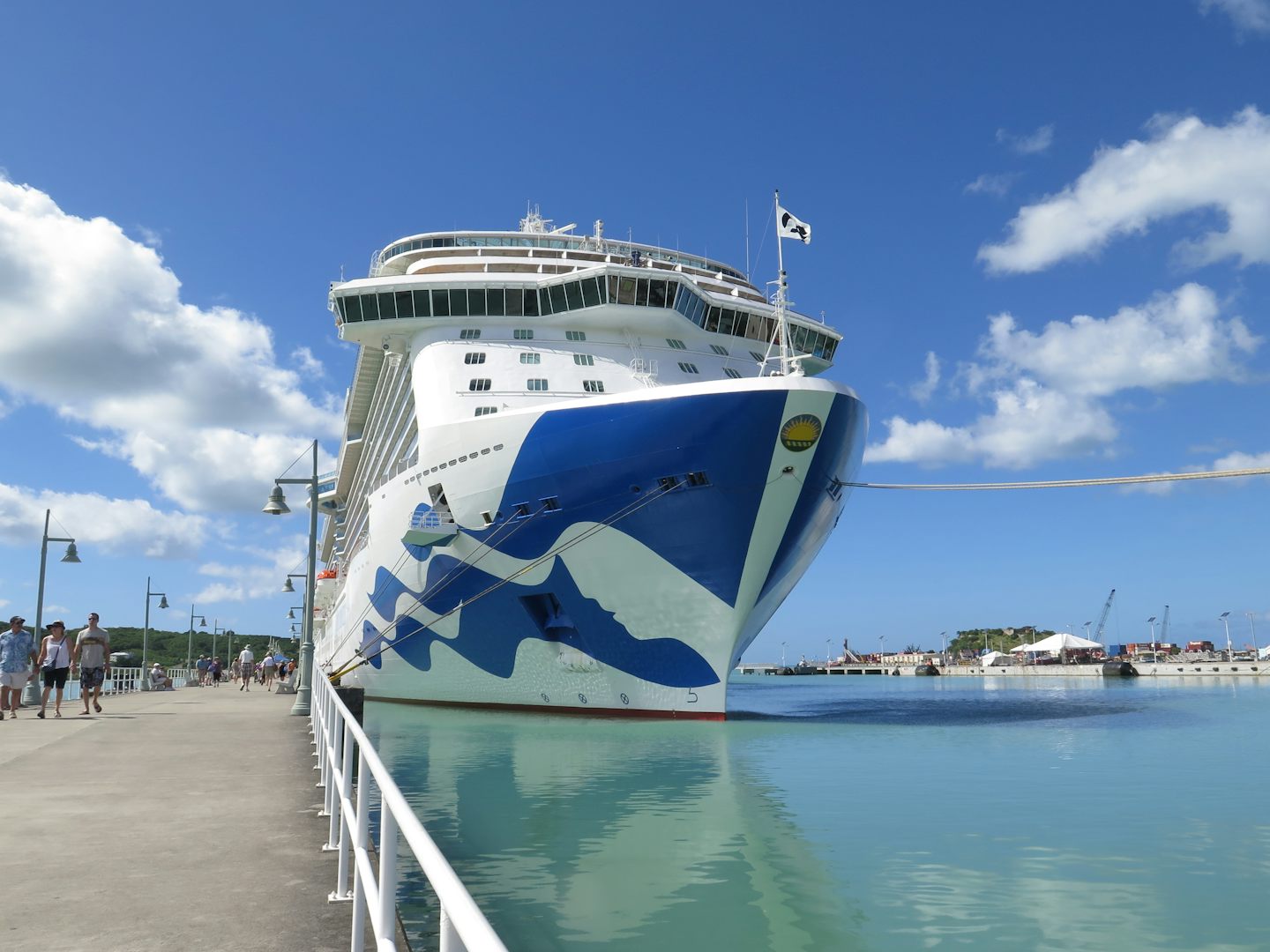 The Royal Princess in port with the landscape of Antigua island.