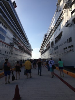 Norwegian Dawn on the right, Carnival on the left. Port at Progresso.