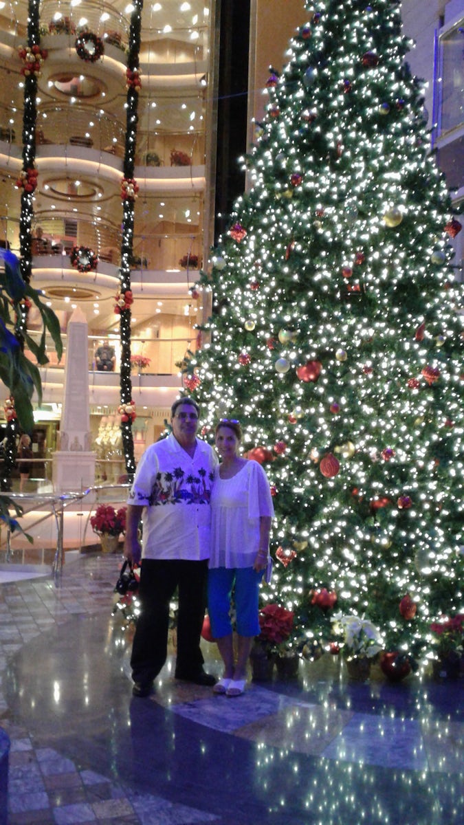 Taking a picture on the Promenade in front of that giant beautiful  christmas tree.