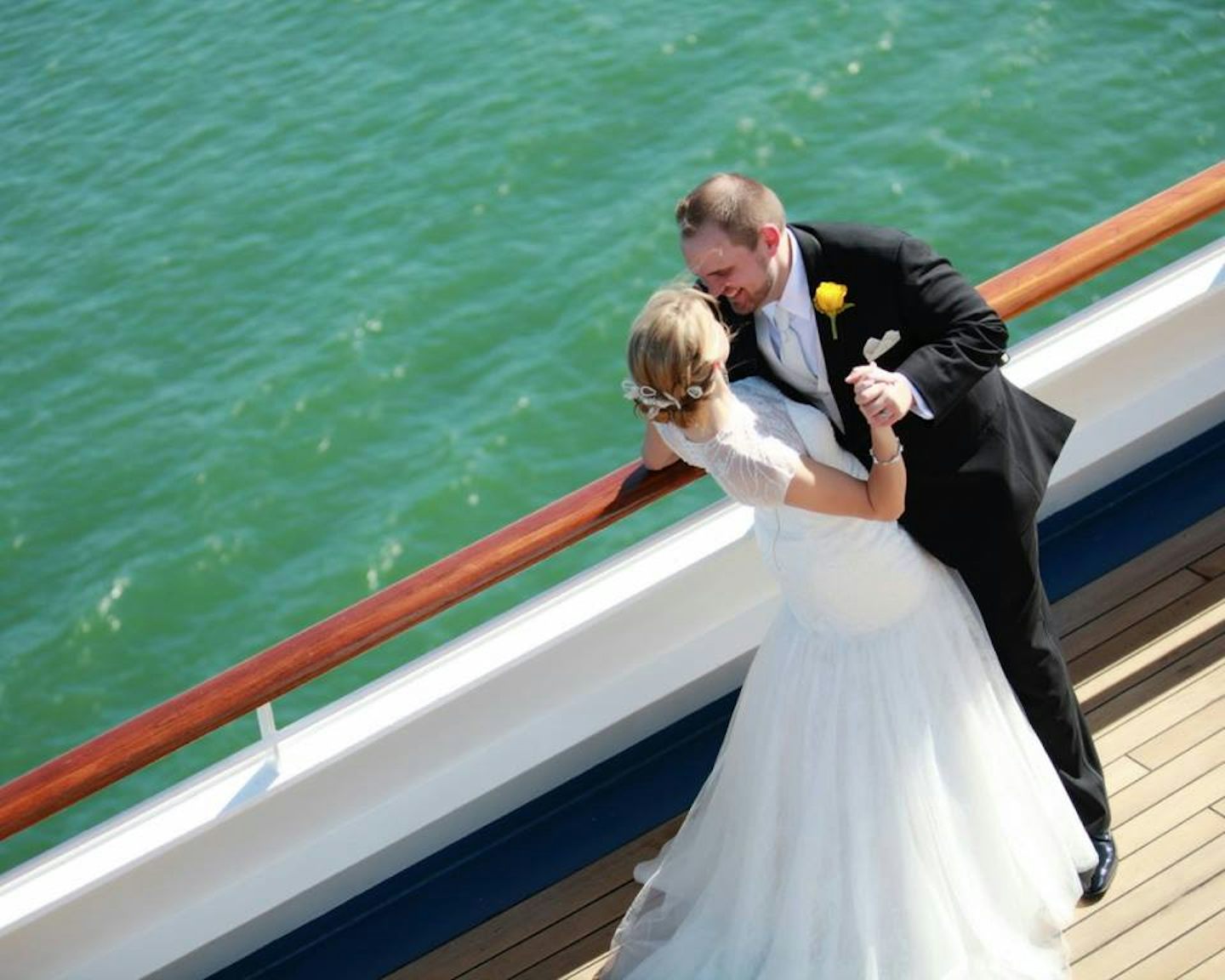 This is from our wedding on Carnival Freedom. We got married on embarkation day during on on-board ceremony with ~80 guests, of whom ~27 cruised with us for the 7-day sailing to Cozumel, Grand Cayman, and Ocho Rios. It was a dream wedding and an unforgettable week with family and friends! It was only too difficult to pick only one photo to submit for this!