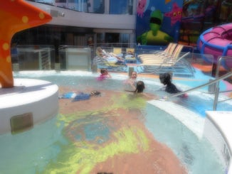Kids in the whirlpool and slides.