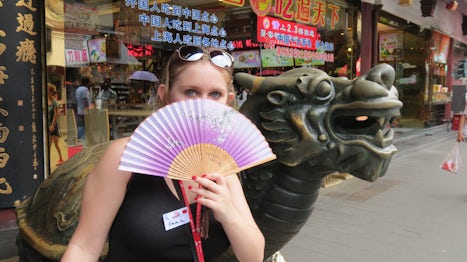 Emma with her new fan in the Shanghai Market.