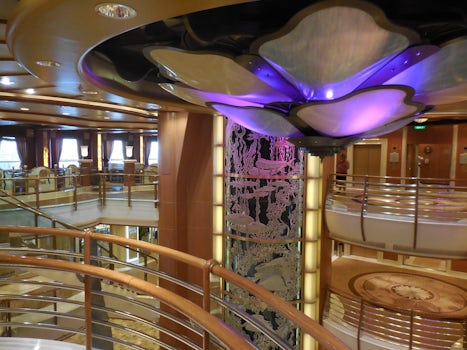 The Caribbean Princess dolphin-themed Piazza with iridescent pillars and Me