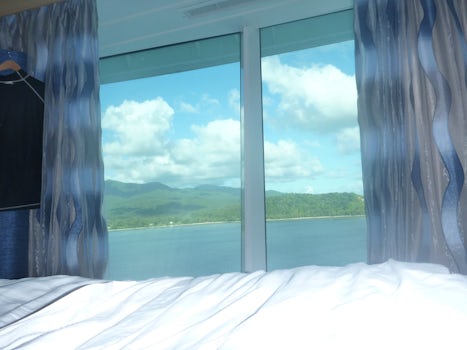 View from bed - Panoramic View Room Deck 12 (1852). Floor to ceiling window