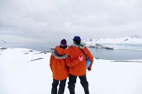 First stop in Antarctica. Ship in the distance. Parkas you are given to kee