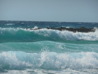 Savoring the beauty of the surf rolling in while exploring Costa Maya.