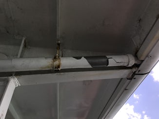Pipe along the side of the veranda, not chipped paint