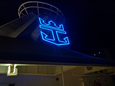 Grandeur of the Seas, Royal Caribbean logo lit up.