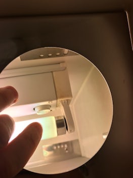 Cover missing from light in bathroom exposing live terminals