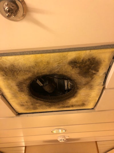 Filthy moldy air filter inside air duct directly on top of cabin ceiling ri