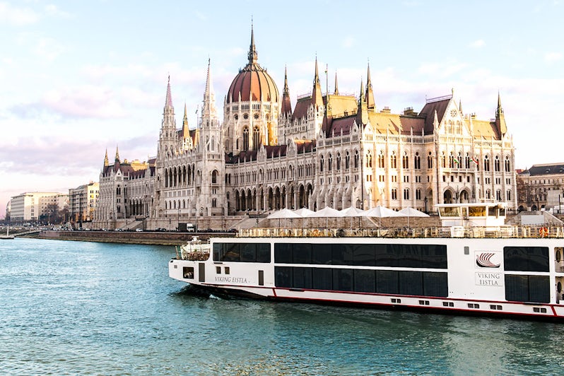 A Viking Longship sails past the parliament building in Budapest Hungary