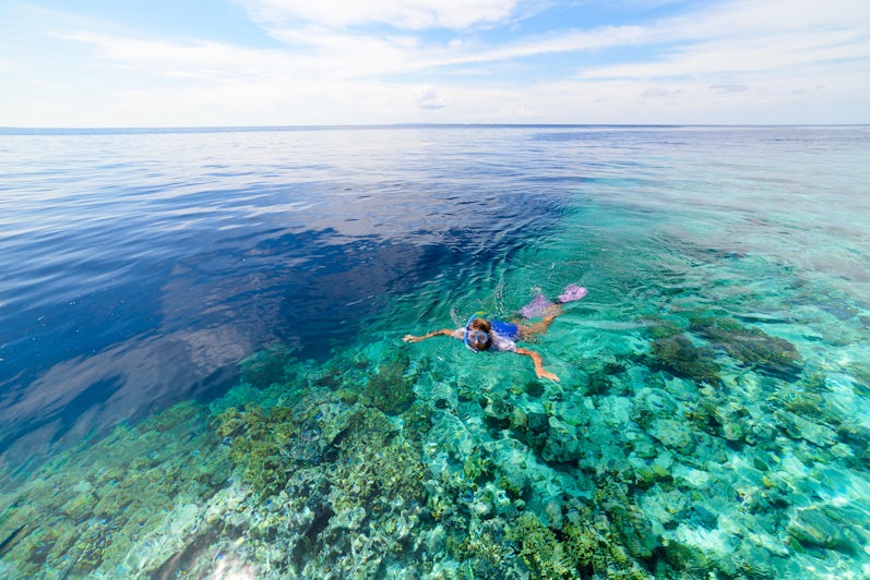Woman Snorkeling Near Shallow Reefs in St. Maarten (Photo: Fabio Lamanna/Shutterstock)