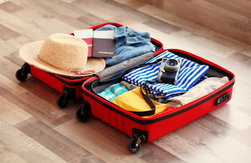 Suitcase with Summer Clothes (Photo: Africa Studio/Shutterstock)