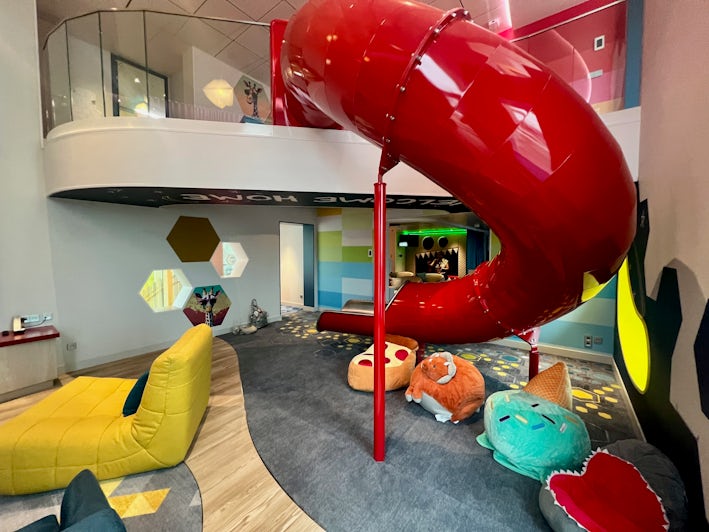 Slide in the living room of the Ultimate Family Townhouse on Icon of the Seas (Photo: Chris Gray Faust)