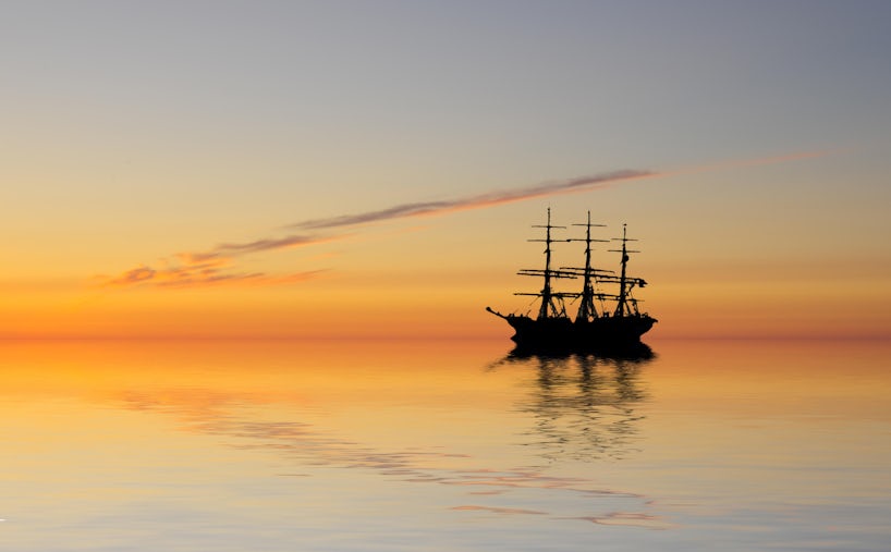 An abandoned ghost ship at sea (Photo: 23d/Shutterstock)