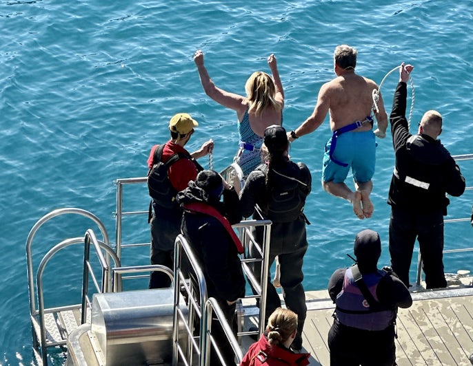 Chris Gray Faust taking the polar plunge in Greenland on Scenic Eclipse II (Photo/Ted Sickler)