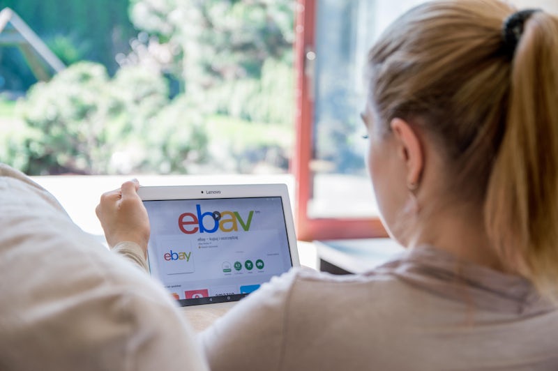 Photo of a woman installing the eBay application on a Lenovo tablet