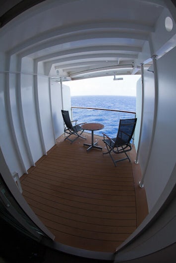 Wide-angel shot of the angled balcony cabin on a Celebrity's Solstice-class ship