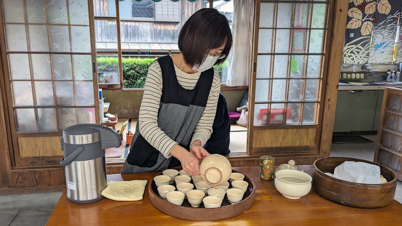 A woman prepares tea in Chiran Samuri Residence Gardens in Minamikyūshū, Japan. (Photo: John Roberts)