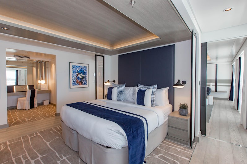 Photo of the blue and white bedroom area in Celebrity Edge's Penthouse Suite