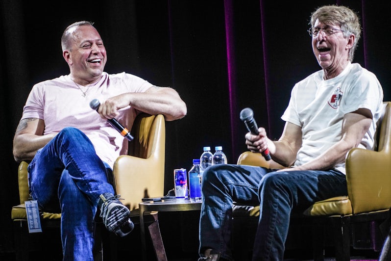 Jon Bon Jovi's brother Matt Bongiovi and long-time producer Obie O'Brien laughing during a Q&A session onstage