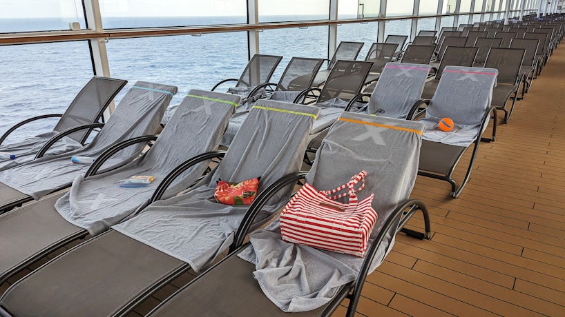 Chair hogs have grabbed chairs early on a sea day on Celebrity Reflection. (Photo: Colleen McDaniel)