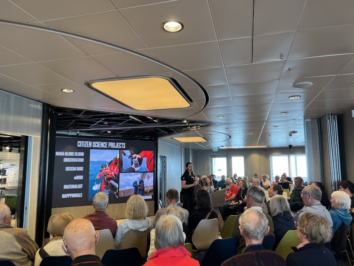 Passengers attend a Citizen Science Project presentation aboard Hurtigruten's MS Roald Amundsen Hurtigruten's MS Roald Amundsen. (Photo: Jorge Oliver)