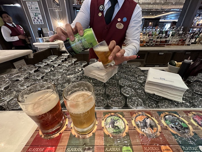 Bartender pours a glass for an Alaskan beer tasting on Majestic Princess (Photo/Alison Fox)