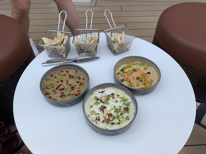 Dishes served in Sunset Bar on Celebrity Ascent include hummus and pita bread