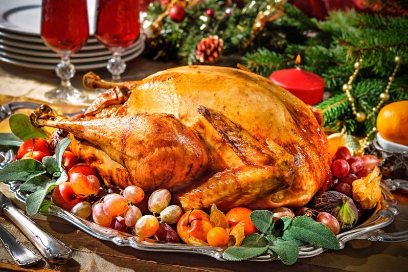 Christmas turkey surrounded by decorations and wine (Photo: Alexander Raths/Cruise Critic)