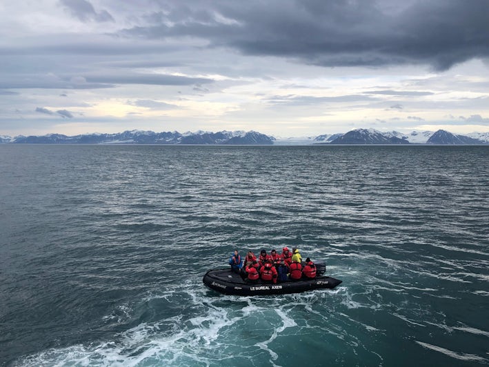 Tauck Travel passengers, traveling on Ponant’s Le Boreal, set off on a Zodiac glacier excursion (Photo: Chris Gray Faust)