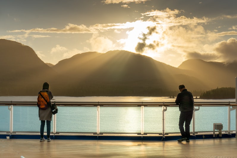 Two people watch the sun set over the Inside Passage (Photo: Aaron Saunders)