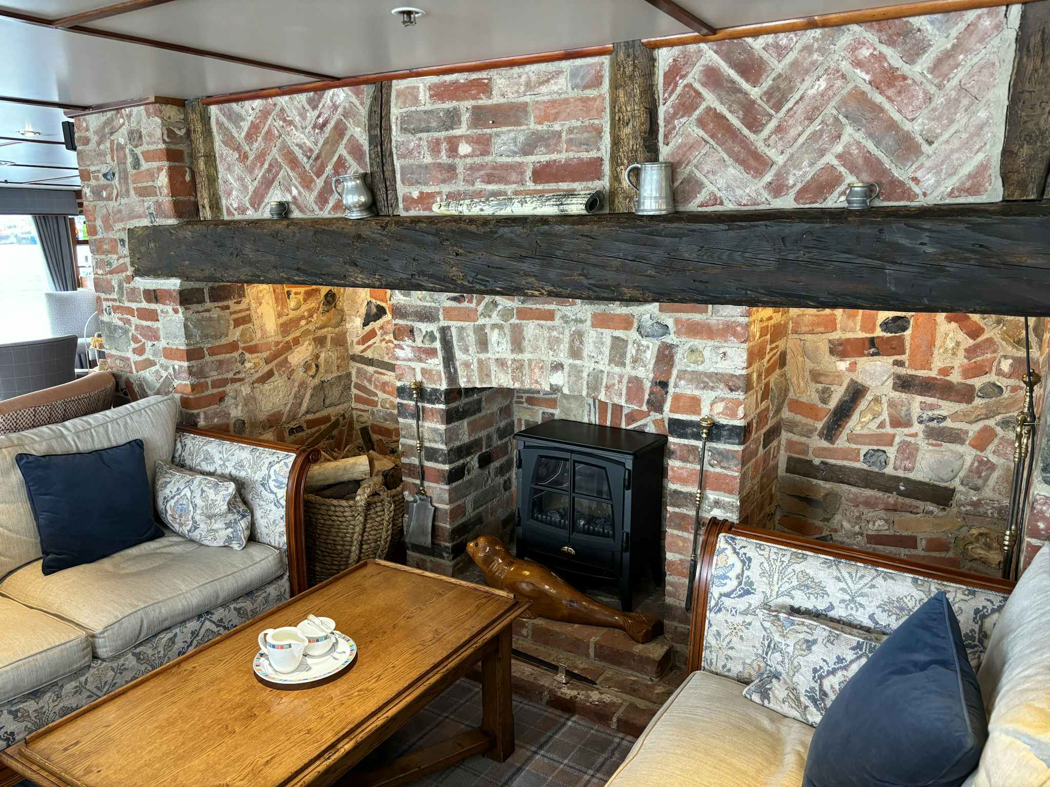 The Tiree Lounge on Hebridean Princess has a real brick fireplace