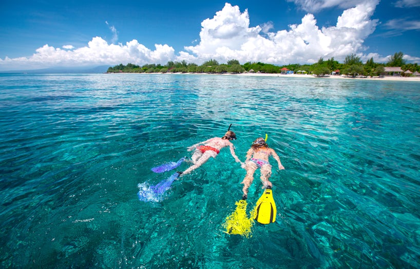 Two Women Snorkeling in the Bahamas (Photo: Dudarev Mikhail/Shutterstock)