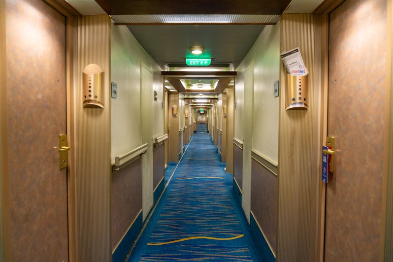 Cabin corridors aboard Carnival Conquest are classic Carnival, but are in good shape (Photo: Aaron Saunders)