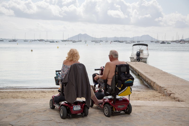 Senior couple on mobility scooters (Photo: The Art of Pics/Shutterstock)