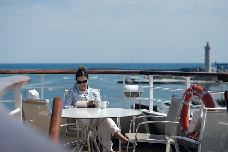 Woman reading a book on the sun deck on Fred. Olsen's Braemar (Photo: Fred. Olsen Cruise Lines)
