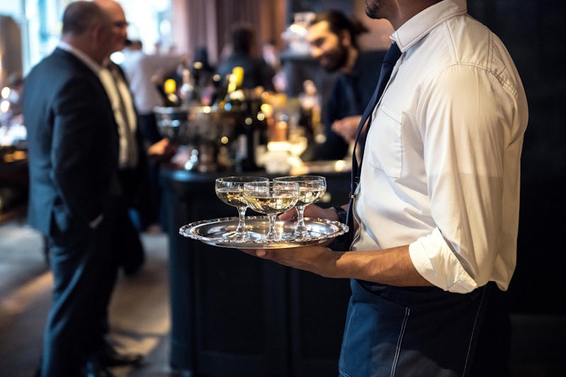 Waiter Catering Champagne for Event (Photo: Nick Starichenko/Shutterstock)