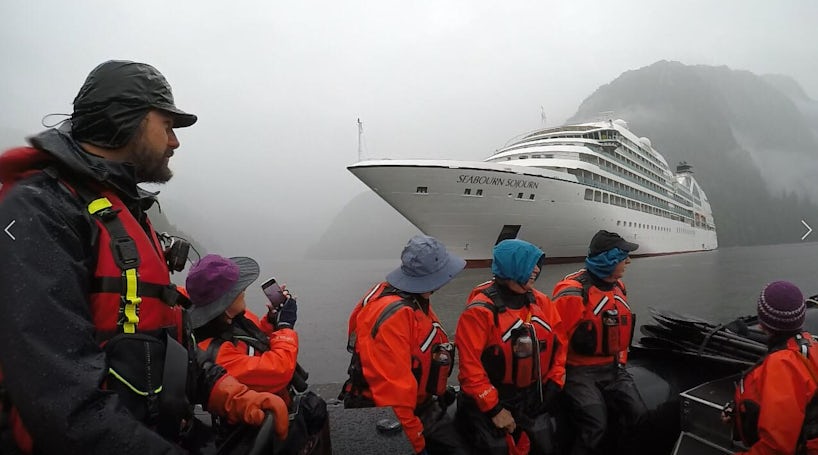 A Zodiac takes Seabourn Sojourn passengers to their kayaks for a Ventures by Seabourn excursion in Alaska's Misty Fjord. (Photo: Ashley Kosciolek)