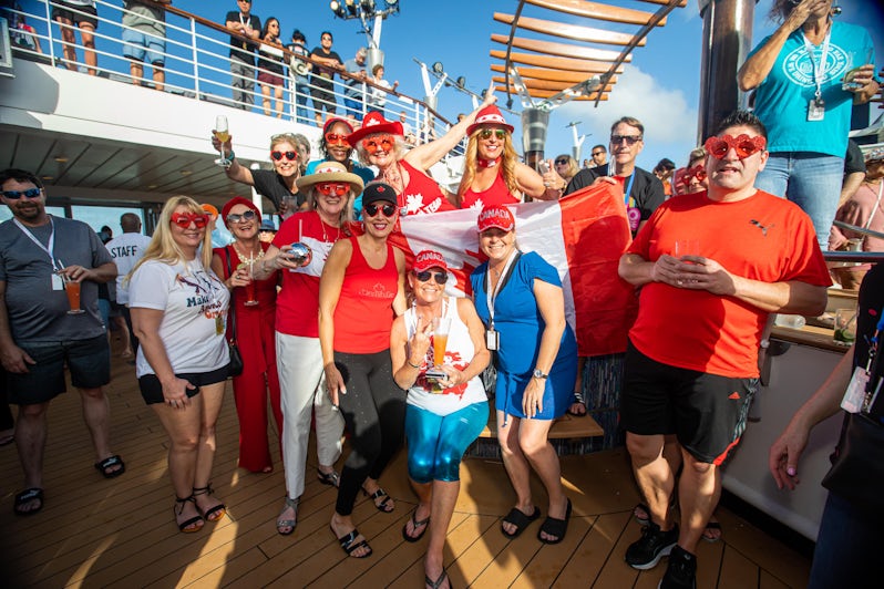 Passengers in matching Canadian outfits on the Ultimate Disco Cruise