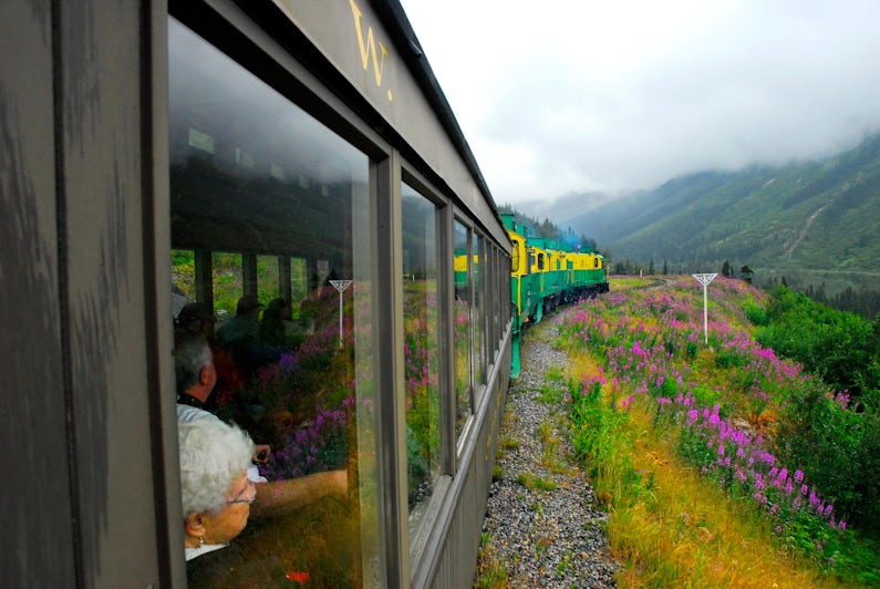 Passengers riding the White Pass Railway from Skagway to the Yukon Territory