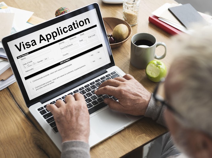 Man Filling out Online Visa Application (Photo: Rawpixel.com/Shutterstock)