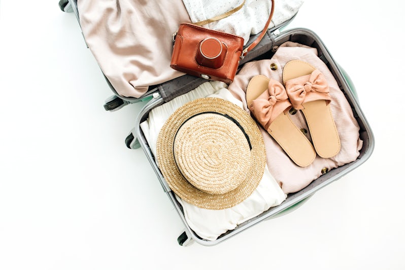 Luggage With Belongings Stored Inside (Photo: Floral Deco/Shutterstock)