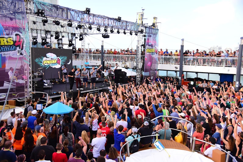 The four Impractical Jokers on the pool deck stage at Impractical Jokers Cruise 4