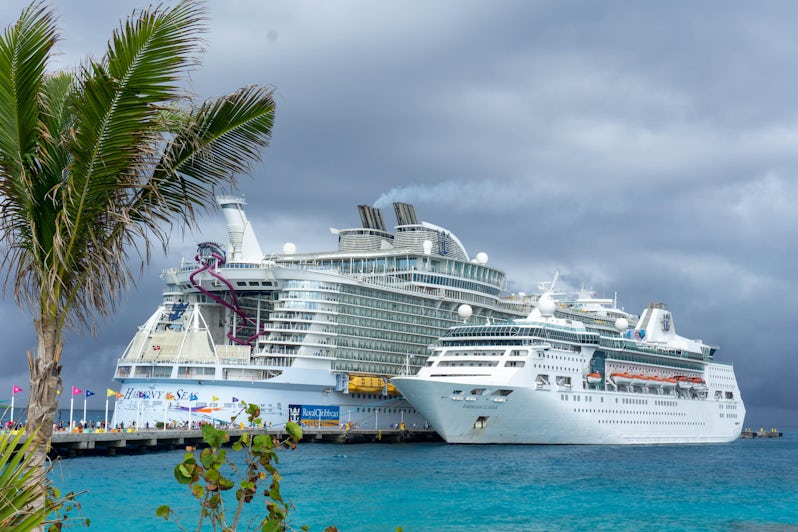 Empress of the Seas and Harmony of the Seas docked next to each other in the Caribbean