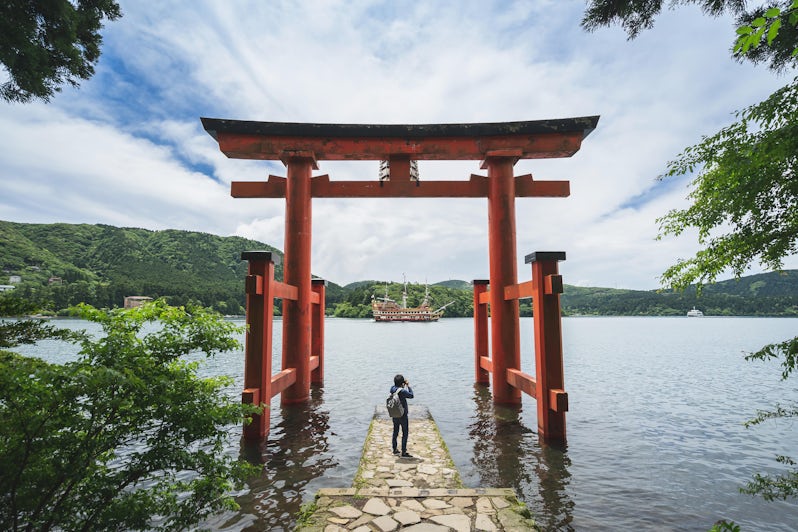 Traveler Photographing Lake Ashi, Japan (Photo: kitzcorner/Shutterstock)