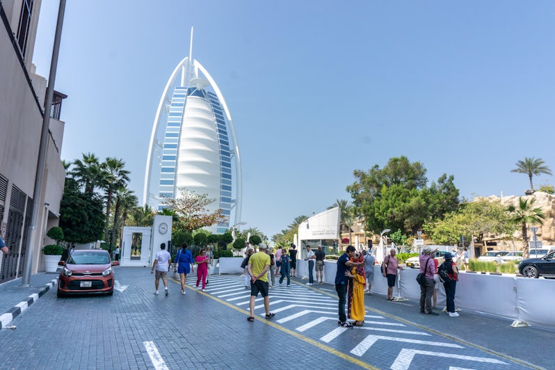 Tourists admire the Jumeriah Burj Al Arab, Dubai's most iconic hotel. (Photo: Aaron Saunders)